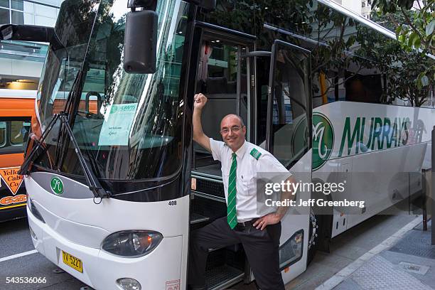 Australia, Queensland, Brisbane Central Business District, Mary Street bus motor coach driver operator man smiling.