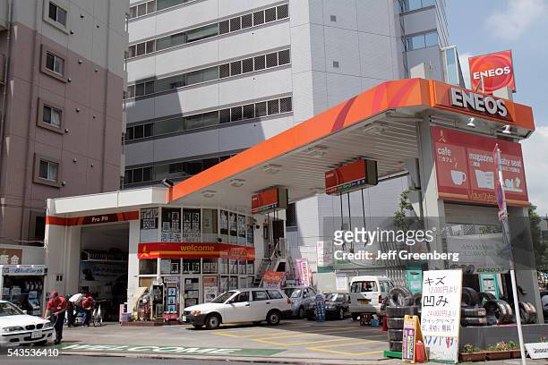 Japan Tokyo Ryogoku kanji hiragana katakana characters symbols Japanese English gas petrol station Eneos auto vehicle automobile.