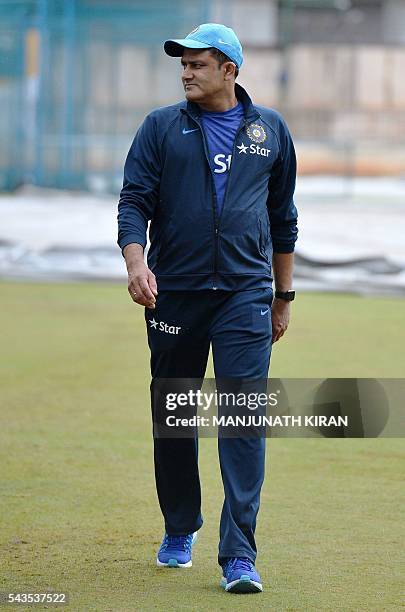 Newly appointed Indian cricket team head coach, Anil Kumble returns after inspecting the ground at the National Cricket Academy where the Indian...