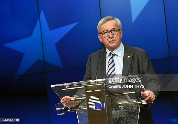 Commission President Jean-Claude Juncker gives a press conference during a EU Summit meeting at the EU headquarters in Brussels on June 29, 2016....