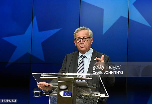 Commission President Jean-Claude Juncker gives a press conference during a EU Summit meeting at the EU headquarters in Brussels on June 29, 2016....