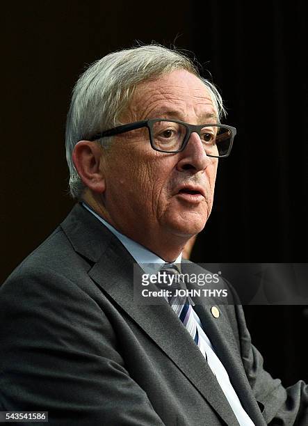Commission President Jean-Claude Juncker gives a press conference during a EU Summit meeting at the EU headquarters in Brussels on June 29, 2016....