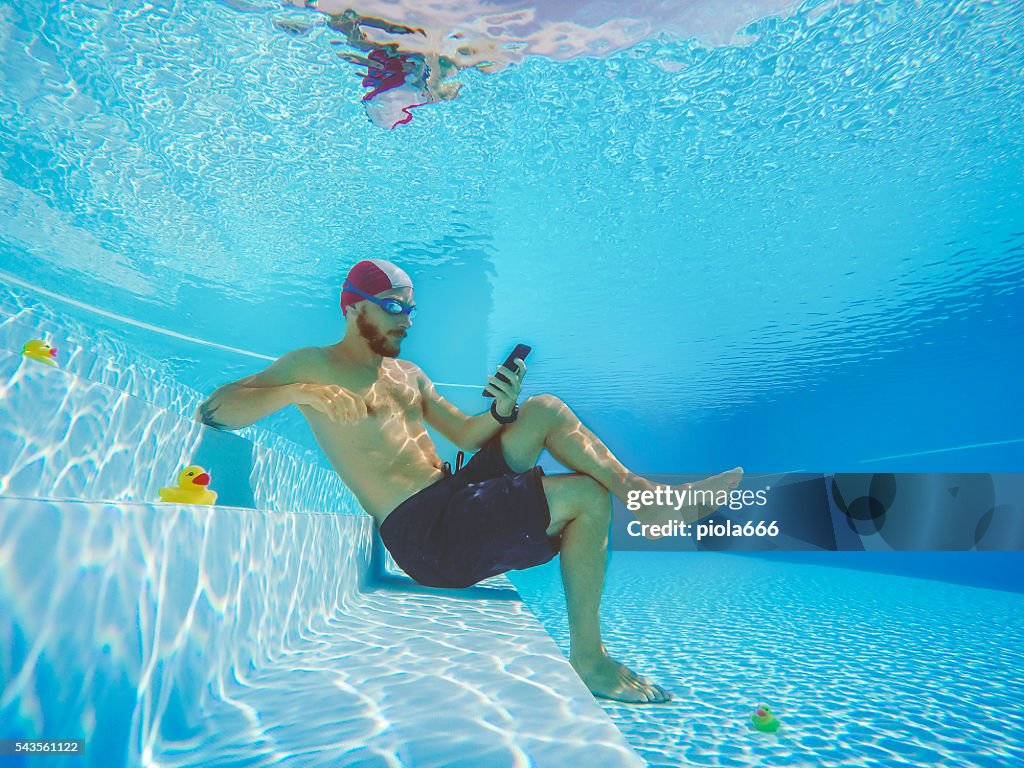 Addicted to social networking: with mobile phone underwater