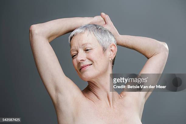 relaxed senior woman with bare shoulders. - beautiful bare women fotografías e imágenes de stock