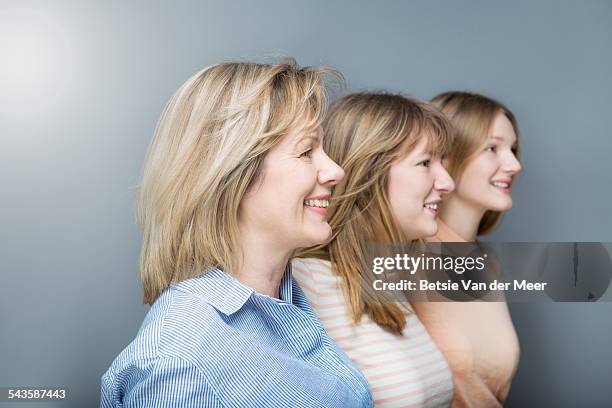 side shot of mother and daughters in studio. - white van profile stock pictures, royalty-free photos & images