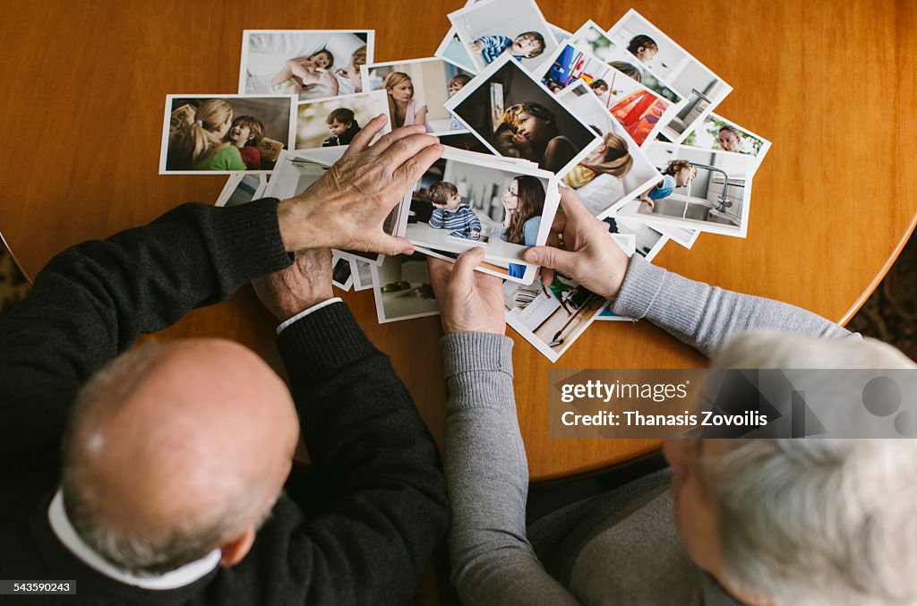Senior couple looking at photos
