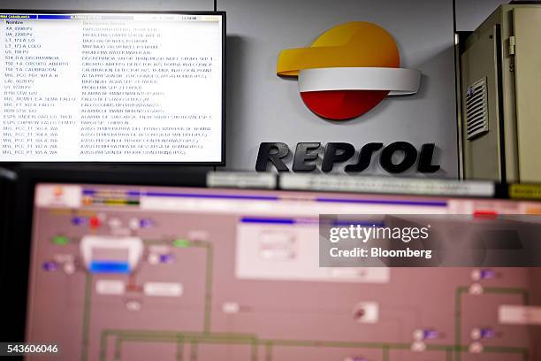 Digital information screens sit in the control room aboard the Casablanca oil platform, operated by Repsol SA, in the Mediterranean Sea off the coast...