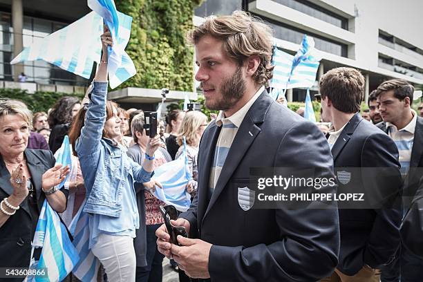 Racing Metro 92's players arrive at the Hauts-de-Seine government house following the team victory of the French Top14 rugby union final match Toulon...