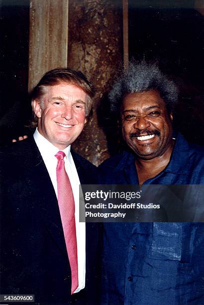 Portrait of American businessman Donald Trump and boxing promoter Don King as they pose together at the Mar-a-Lago estate, Palm Beach, Florida, 1999.