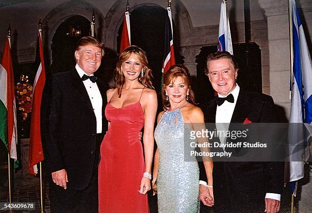 Group portrait of, from left, American businessman Donald Trump and his wife, Melania Trump, and married television hosts Joy and Regis Philbin as...