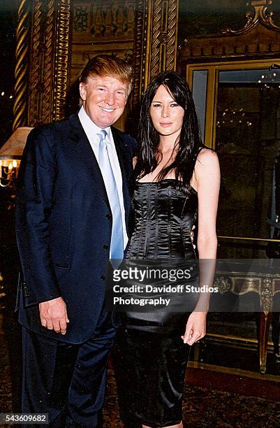 Portrait of American businessman Donald Trump and model Melania Knauss as they pose together at the Mar-a-Lago estate, Palm Beach, Florida, 2004.