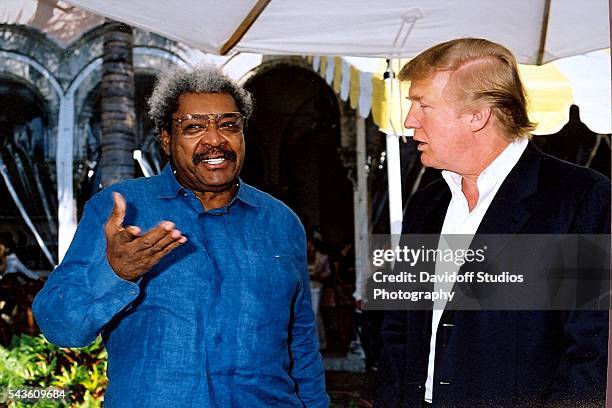 Portrait of American boxing promoter Don King and businessman Donald Trump as they pose together at the Mar-a-Lago estate, Palm Beach, Florida, 2005.