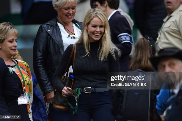 Jennifer Bate, girlfriend of Britain's Marcus Willis, arrives to take her seat in the royal box on centre court to watch Marcus Willias play against...