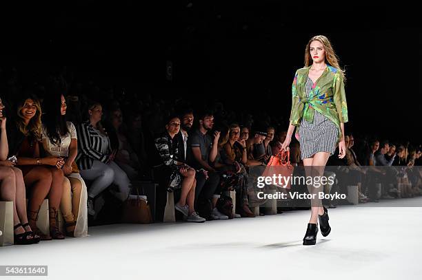 Model walks the runway at the Anja Gockel show during the Mercedes-Benz Fashion Week Berlin Spring/Summer 2017 at Erika Hess Eisstadion on June 29,...