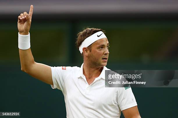Marcus Willis of Great Britain celebrates winnig a point during the Men's Singles second round match against Roger Federer of Switzerland on day...
