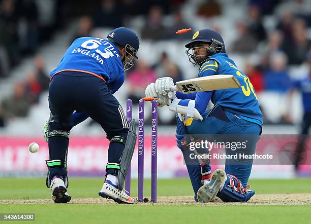 Dinesh Chandimal of Sri Lanka is bowled out by David Willey during the 4th Royal London ODI between England and Sri Lanka at The Kia Oval on June 29,...