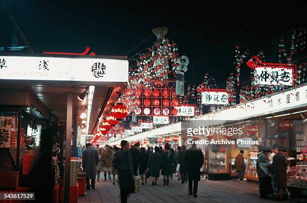 Busy shopping district in Tokyo, Japan, circa 1965.