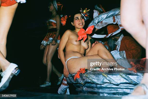 Women performing in a topless revue show at a music hall in Tokyo, Japan, circa 1965.