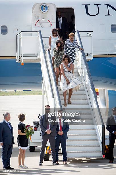 First Lady Michelle Obama, her mother Marian Shields Robinson and her daughters Malia Obama and Sasha Obama arrive at Torrejon Air Force Base on June...