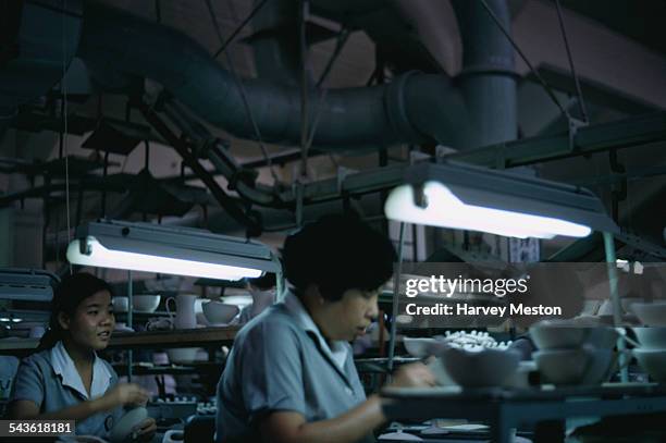 Women working in a warehouse at the Noritake Co., Limited factory in Japan, July 1970.