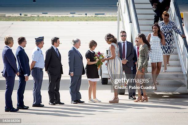 First Lady Michelle Obama, her mother Marian Shields Robinson and her daughters Malia Obama and Sasha Obama arrive at Torrejon Air Force Base on June...