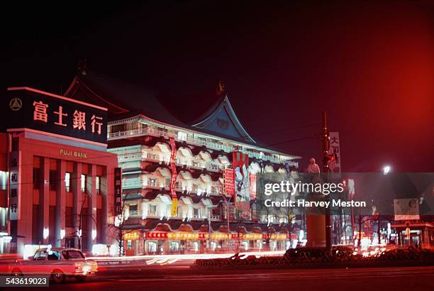 Bank and shops at night in Japan, 1969.