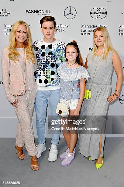 Jenny Elvers and her son Paul and Anne Sophie Briest and her daughter Faye Montana attend the Guido Maria Kretschmer show during the Mercedes-Benz...