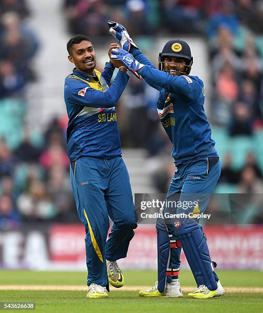 Danushka Gunathilaka of Sri Lanka celebrates with Dinesh Chandimal after dismissing Joe Root of England during the 4th ODI Royal London One Day...