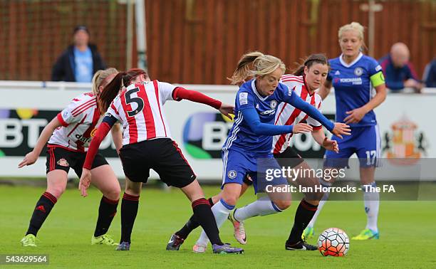 Gemma Davison of Chelsea tries to evade the Sunderland defence during the WSL 1 League match between Sunderland Ladies and Chelsea Ladies FC at the...