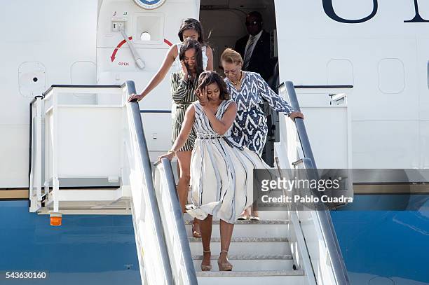 First Lady Michelle Obama, her mother Marian Shields Robinson and her daughters Malia Obama and Sasha Obama arrive at Torrejon Air Force Base on June...