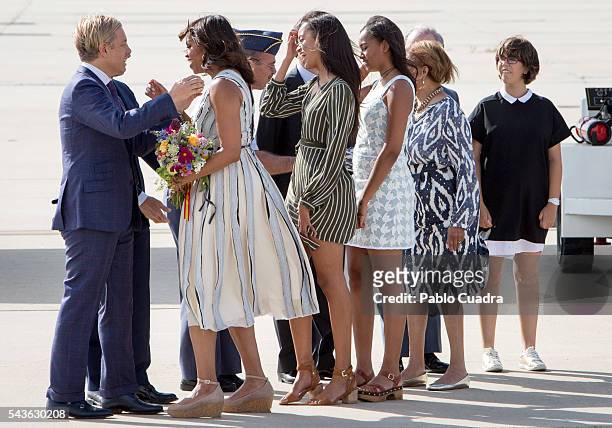 First Lady Michelle Obama, her mother Marian Shields Robinson and her daughters Malia Obama and Sasha Obama arrive at Torrejon Air Force Base on June...