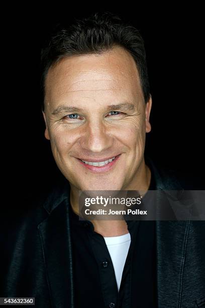 Guido Maria Kretschmer poses for photographs backstage ahead of his show during the Mercedes-Benz Fashion Week Berlin Spring/Summer 2017 at Erika...