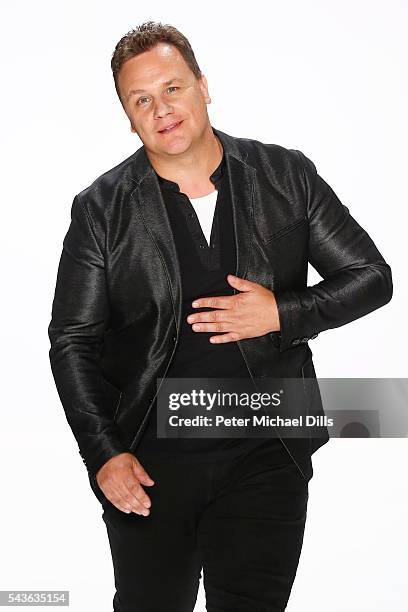 Designer Guido Maria Kretschmer acknowledges the applause of the audience at the runway after his show during the Mercedes-Benz Fashion Week Berlin...