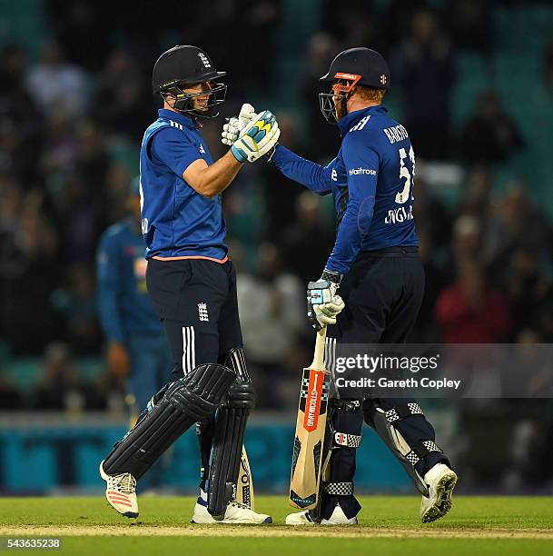 Jos Buttler and Jonathan Bairstow of England celebrate winning the 4th ODI Royal London One Day International match between England and Sri Lanka at...
