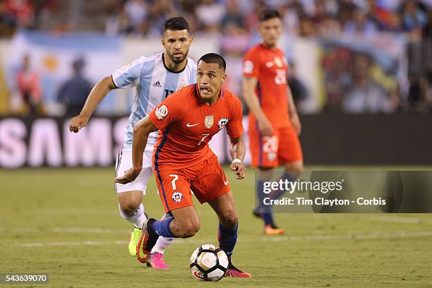 Alexis Sanchez of Chile on the ball watched by Sergio Aguero of Argentina during the Argentina Vs Chile Final match of the Copa America Centenario...