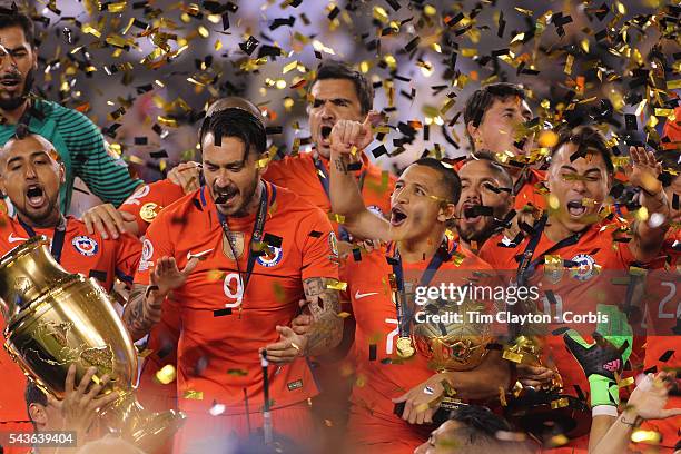 Alexis Sanchez, , #7 of Chile celebrates with team mates at the trophy presentation during the Argentina Vs Chile Final match of the Copa America...