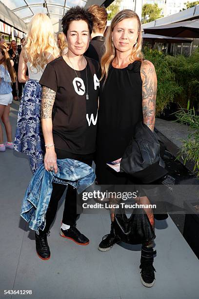Dunja Hayali and a guest attend the Guido Maria Kretschmer show during the Mercedes-Benz Fashion Week Berlin Spring/Summer 2017 at Erika Hess...