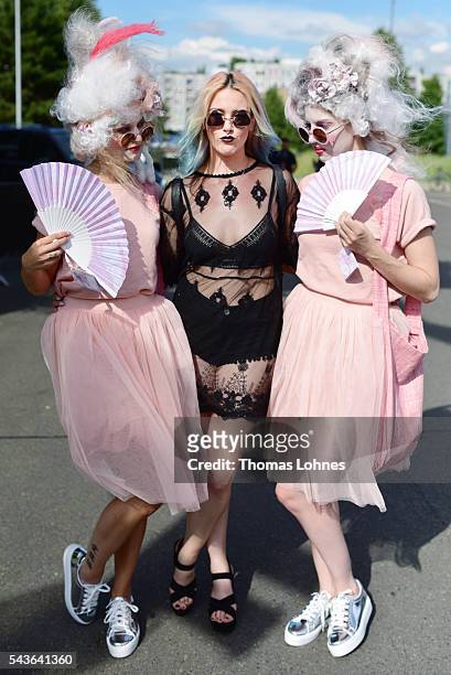 Schlesi wearing second hand clothes of H&M with two models of Delasocial during the Mercedes-Benz Fashion Week Berlin Spring/Summer 2017 on June 29,...