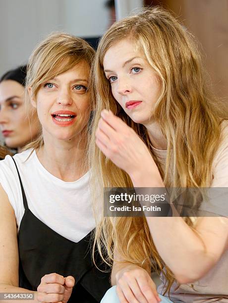 German actress Heike Makatsch and german actress Pheline Roggan attend the Malaikaraiss defilee during the Der Berliner Mode Salon Spring/Summer 2017...