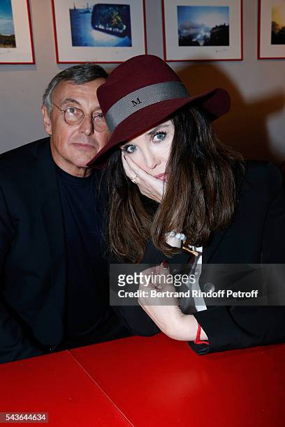 Pierre Passebon and Isabelle Adjani attend the Private View of "Francoise Sagan, Photographer" : Photo Exhibition at Galerie Pierre Passebon on June...