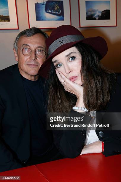 Pierre Passebon and Isabelle Adjani attend the Private View of "Francoise Sagan, Photographer" : Photo Exhibition at Galerie Pierre Passebon on June...