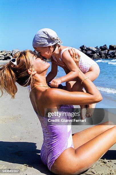 The Venezuelan actress and model Catherine Fulop with her daughter Oriana on a beach in Caracas, First February1998, Venezuela. .