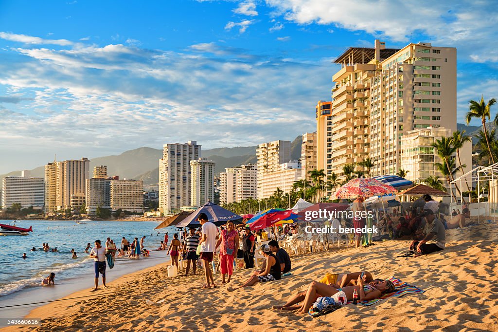 Beach with Row of Hotels and People in Acapulco Mexico