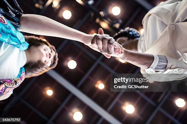 business executives shaking hands over an agreement. - ice breaking stock pictures, royalty-free photos & images