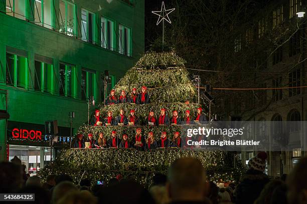 Singing christmas tree during christmas time, Werdmühleplatz, Zürich, Switzerland.