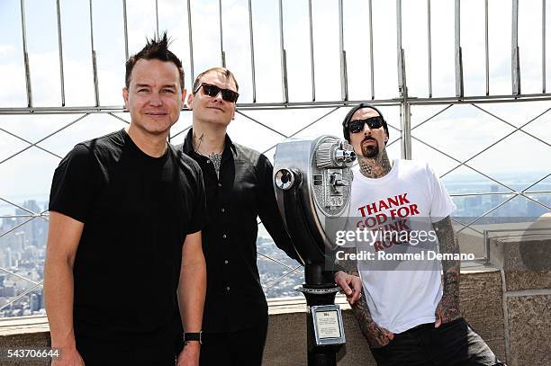 Mark Hopus, Matt Skiba and Travis Barker of Blink-182 visit at The Empire State Building to promote new album "California" on June 29, 2016 in New...