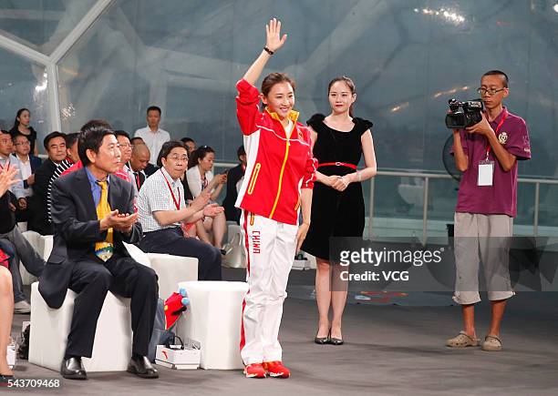 Chinese trampoline gymnast He Wenna attends the unveiling ceremony of the Chinese Olympic team's uniforms for Rio 2016 Olympic Games at Water Cube on...