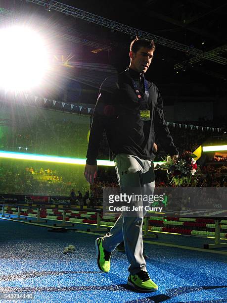 Michael Phelps of the United States participates in the medal ceremony for the Men's 200 Meter Butterfly during Day Four of the 2016 U.S. Olympic...