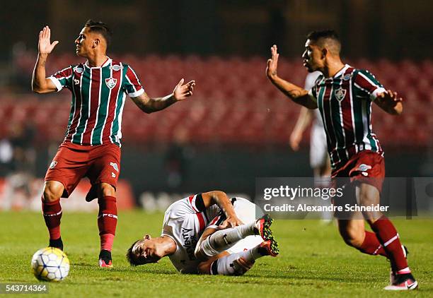 Dudu of Fluminense, Centurion of Sao Paulo and Douglas of Fluminense in action during the match between Sao Paulo and Fluminense for the Brazilian...