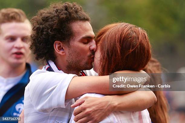 Couple hugging in sadnesss after france World Cup elimination